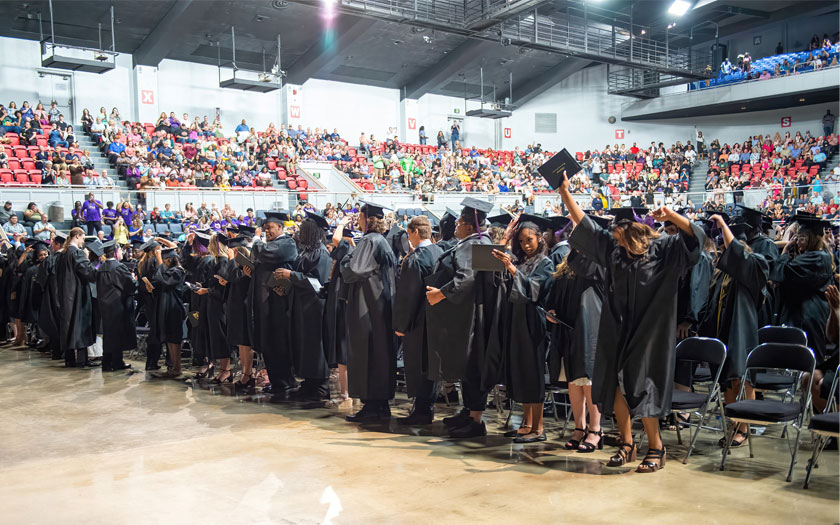 Alabama Connections Academy graduation, the graduates prepare to throw their caps into the air. 